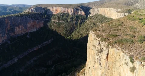 Drone flight over deep cliffs in mountains and forests Stock Footage 124222751