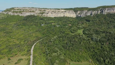 Drone flight over dense green forest and terrain in Madara Bulgaria Stock Footage 345367309