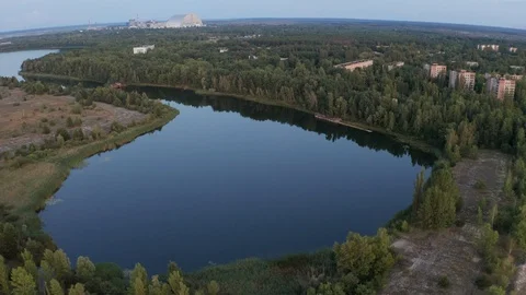 Drone flight over deserted Pripyat river and town Video stock 115455543