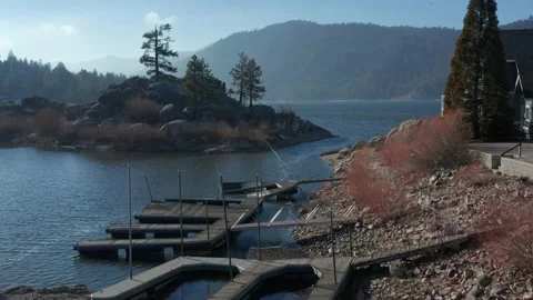 Drone flight over docks rising over lake and island Shot 4K Stock Footage 150200117