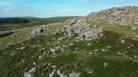 Drone flight over Down Tor in Dartmoor Nationa Park UK Stock Footage 205829640
