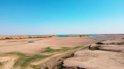 Drone flight over the dry-type playa and the lake Vídeos de archivo 218612915
