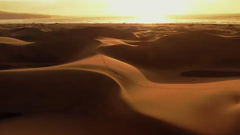 Drone Flight over the Dunes of Maspalomas at Sunrise. Video stock 263514767