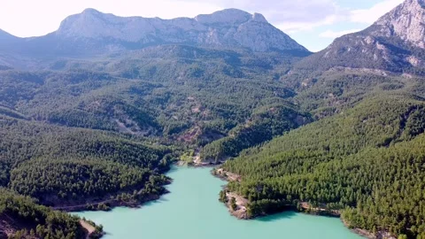 Drone flight over an emerald mountain lake Stock Footage 153065734