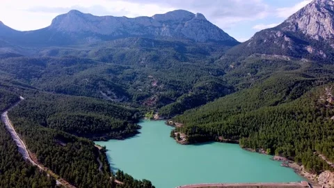 Drone flight over an emerald mountain lake Stock Footage 153065859