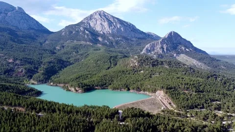 Drone flight over an emerald mountain lake Stock Footage 153066261