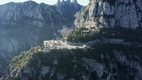 Drone flight over the famous mountain range of Catalonia; sunny winter Stock Footage 104122613