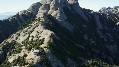 Drone flight over the famous mountain range of Catalonia; sunny winter Stock Footage 104122709