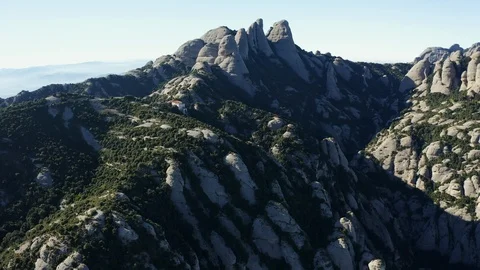 Drone flight over the famous mountain range of Catalonia; sunny winter Video stock 104122865
