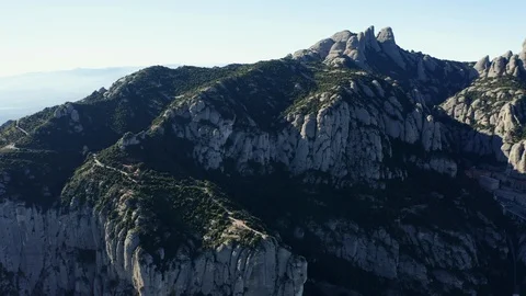 Drone flight over the famous mountain range of Catalonia; sunny winter Stock Footage 104124093