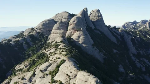 Drone flight over the famous mountain range of Catalonia; sunny winter Stock Footage 104124536