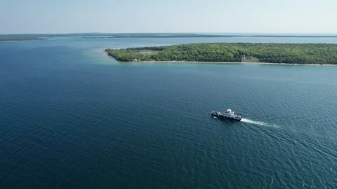 Drone flight over a ferry transporting many cars in lake Michigan Stock Footage 267653944