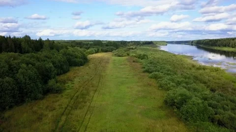 Drone flight over a field river and forest, in the country Stock Footage 142895394