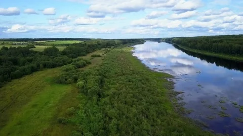 Drone flight over a field river and forest, in the country Stock Footage 142895856