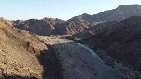 Drone Flight Over Fish River Canyon Trail and Rugged Mountains in Namibia 4K Stock Footage 337440854