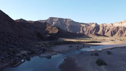 Drone Flight Over Fish River Canyon Trail and Rugged Mountains in Namibia 4K Stock Footage 337440949