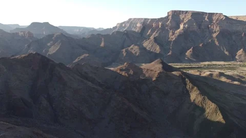 Drone Flight Over Fish River Canyon Trail and Rugged Mountains in Namibia 4K Stock Footage 337441050