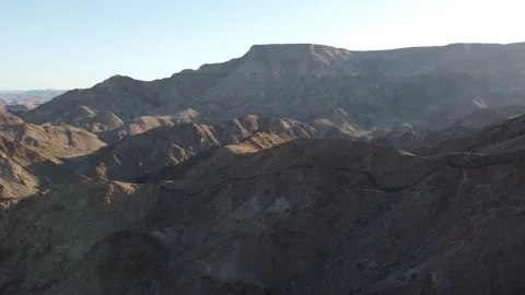Drone Flight Over Fish River Canyon Trail and Rugged Mountains in Namibia 4K Stock Footage 337441095
