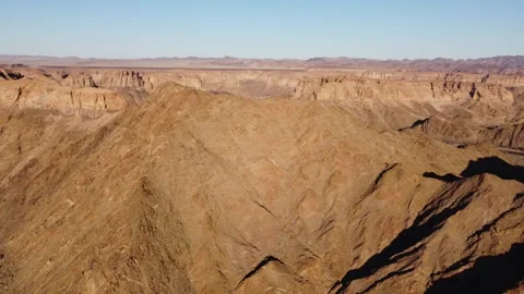Drone Flight Over Fish River Canyon Trail and Rugged Mountains in Namibia 4K Stock Footage 337441190