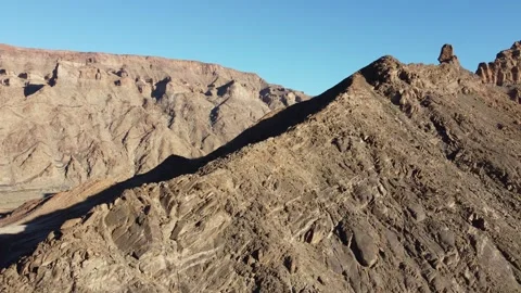 Drone Flight Over Fish River Canyon Trail and Rugged Mountains in Namibia 4K Stock Footage 337451312