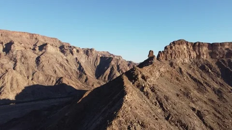 Drone Flight Over Fish River Canyon Trail and Rugged Mountains in Namibia 4K Stock Footage 337451559