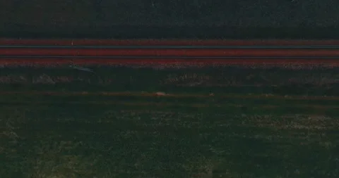 Drone flight over grass, nature at sunset. Top view of the small town, trees  Stock Footage 189856909