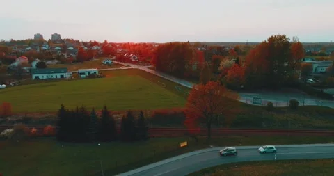 Drone flight over grass, nature at sunset. Top view of the small town, trees  Stock Footage 189863557