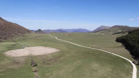 Drone flight over a grazing in the mountains Video stock 182457048