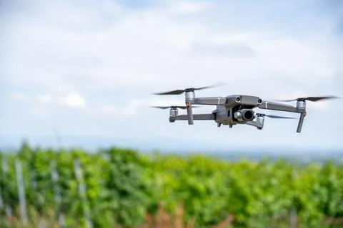Drone in Flight over Green Fields: Aerial Technology &amp; Landscape Stock Photos