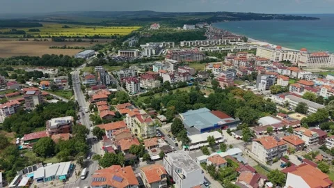 Drone flight over green terrain and town edges in Obzor, Bulgaria Stock-Footage 344472249