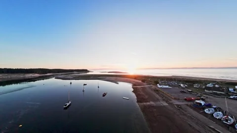 Drone Flight over harbour and beach at sunset Video stock 314797500