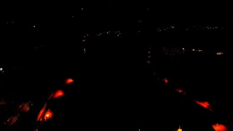Drone flight over illuminated river dam at night Stock Footage 328036632