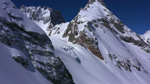 Drone flight over incredible epic mountain landscape winter snow Stock Footage 200498915