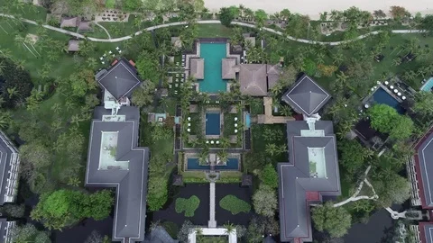 Drone flight over Intercontinental Bali Resort in Jambaran Bay Stock Footage 95419710