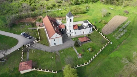 Drone Flight Over Đipša Orthodox Monastery and Rolling Green Landscape Stock Footage 305942770
