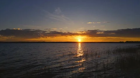 Drone Flight Over the Lake: 4K Sunset View Stock Footage 311944167
