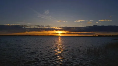 Drone Flight Over the Lake: 4K Sunset View Stock Footage 311944388