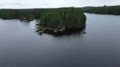 Drone flight over a lake and a forest in Sweden. Stock Footage 248099206