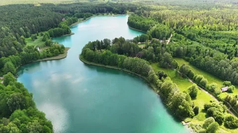 Drone flight over a lake and forests in Lithuania Stock Footage 312334185