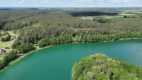 Drone flight over a lake and forests in Lithuania Stock Footage 312334213