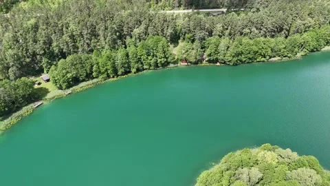 Drone flight over a lake and forests in Lithuania Stock Footage 312334301