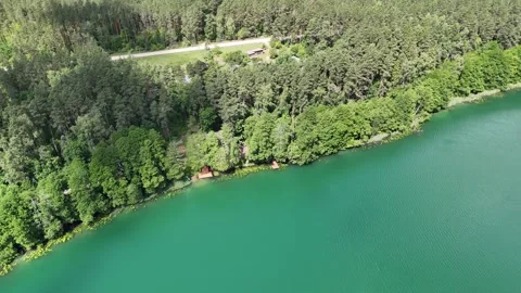 Drone flight over a lake and forests in Lithuania Stock Footage 312334319