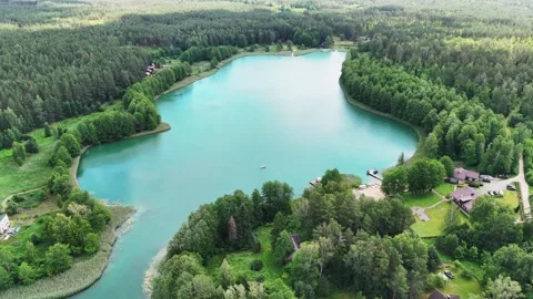 Drone flight over a lake and forests in Lithuania Stock Footage 312334412