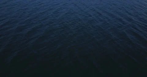 Drone flight over the lake, camera goes up Stock Footage 95217271