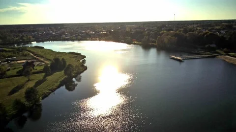 Drone flight over the lake during sunset Stock Footage 163015318