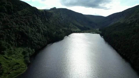 Drone flight over lake in the Wicklow Mountains, Glendalough, Ireland Stock Footage 346746184