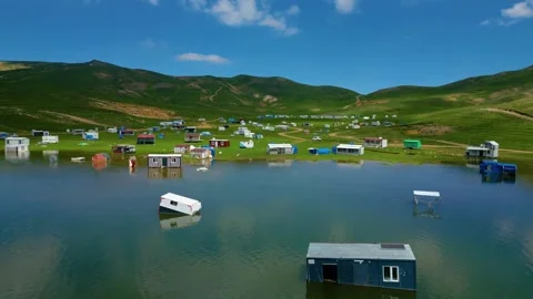 Drone Flight Over Lakeside Community Stockbeeldmateriaal 337100845