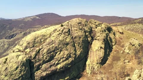 Drone flight over large boulder reveals natural beauty area Balkan mountains Stock Footage 182306779