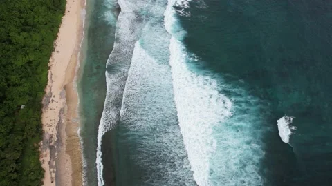 Drone Flight Over Large Foamy Waves on Sawangan Beach Stockbeeldmateriaal 237467612