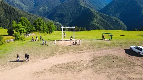 Drone flight over large swing against background of mountains in Georgia Video stock 214332097